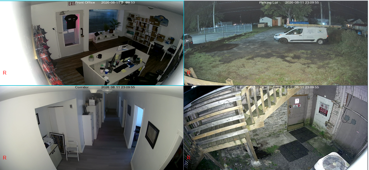 AiBase quad-camera view at 11:09 PM at night, showing the same four camera views still in full colour